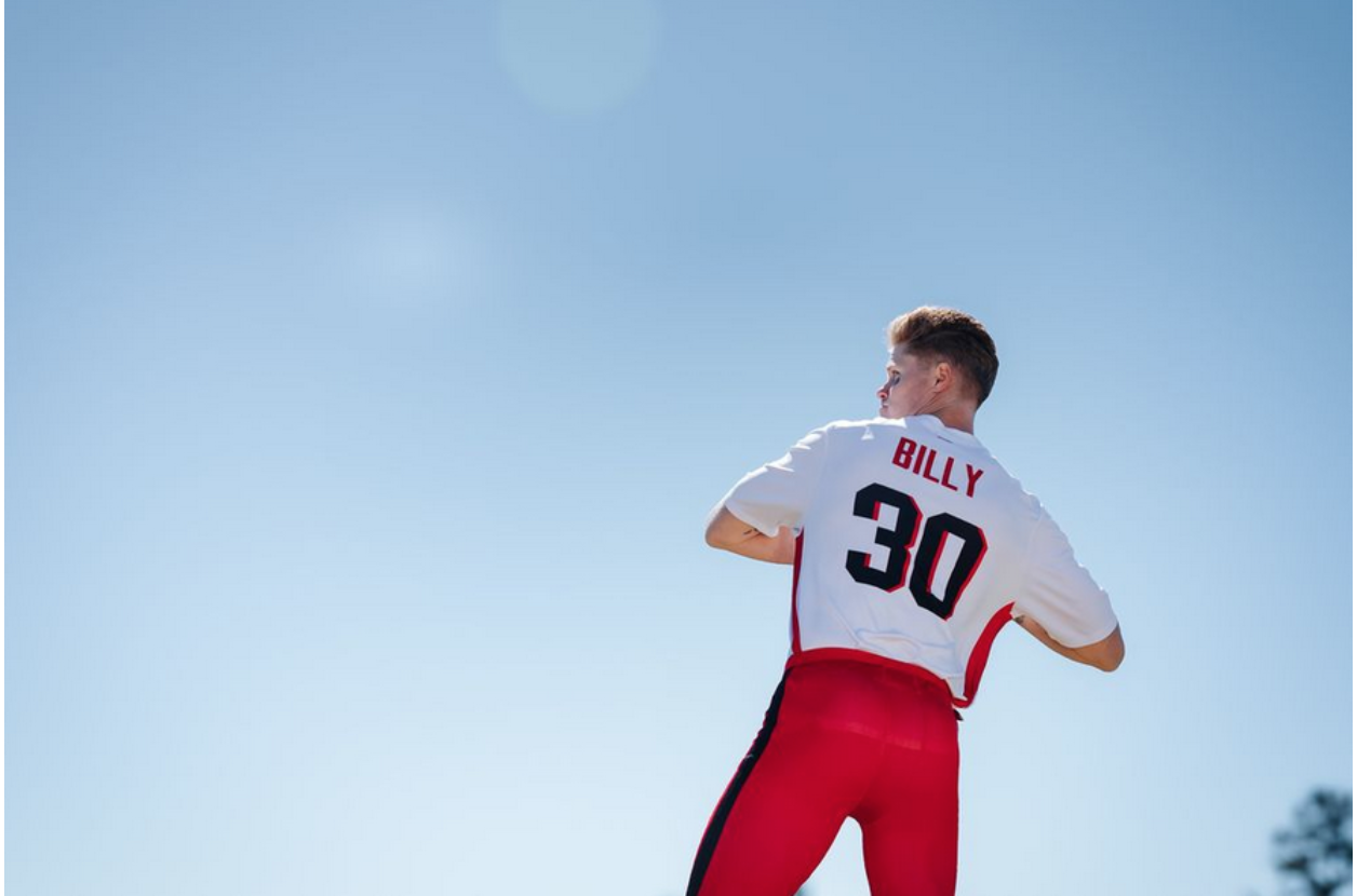 Man in a white and red football jersey uniform.