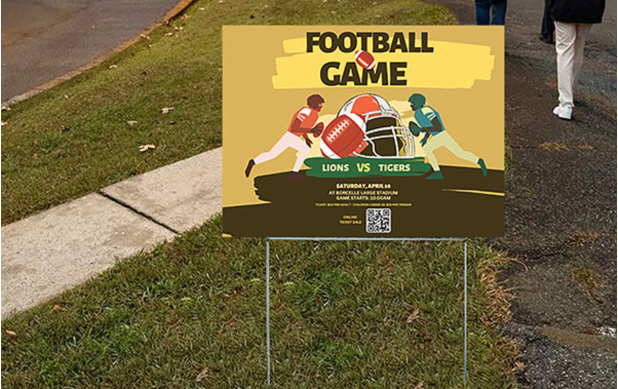 Yard sign advertising Lions vs. Tigers football game near crowd